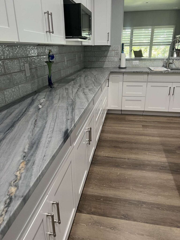 Gray quartzite countertop run with dramatic veining, Austin TX