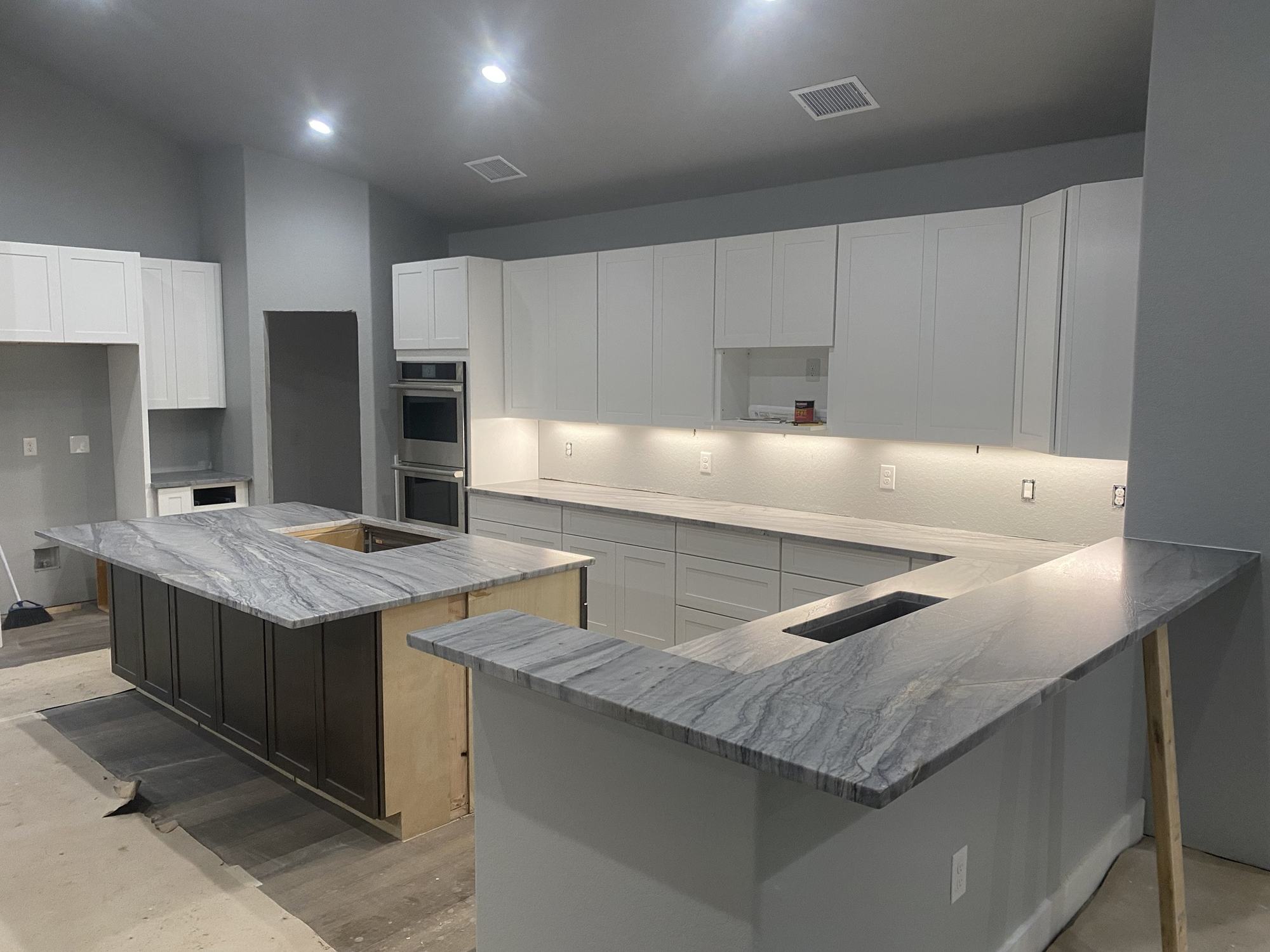 Gray quartzite kitchen island and raised peninsula countertops, Austin TX