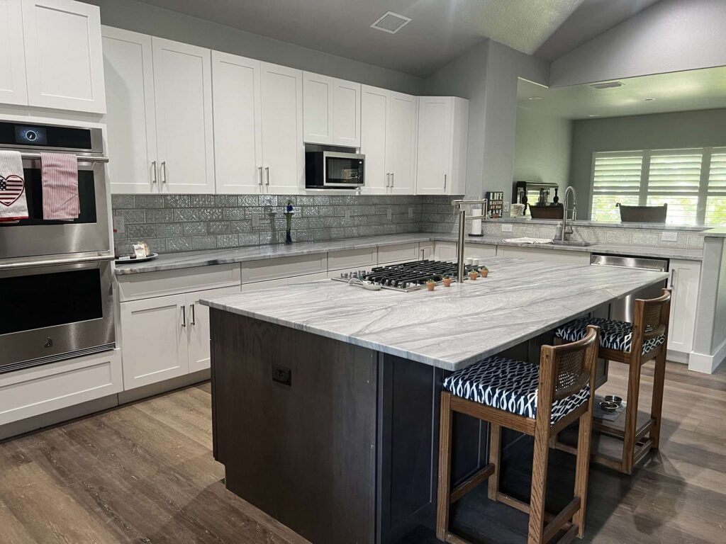 Gray quartzite kitchen island and countertops with white cabinets, Austin TX
