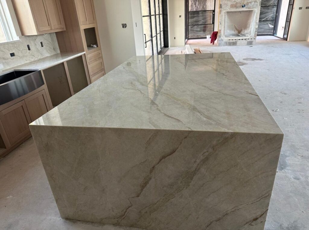 Taupe quartzite island with mitered waterfall edges, Austin TX